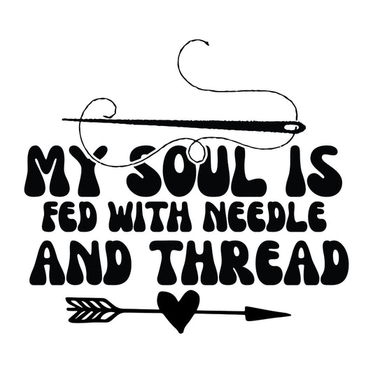 Black and White My Soul is Fed Fabric Panel with needle, thread, and arrow heart design in bold black text on white background