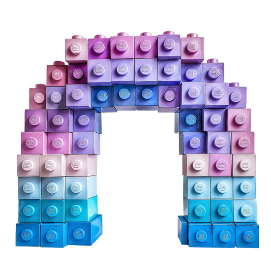 building blocks, lego bricks, toy blocks, purple gradient, blue gradient, pink gradient, ombre effect, children's fabric, playful design, geometric pattern, interlocking blocks, kid's room, nursery fabric, quilting panel, cotton fabric, rainbow colors, pastel shades, childhood toys, construction blocks, craft panel